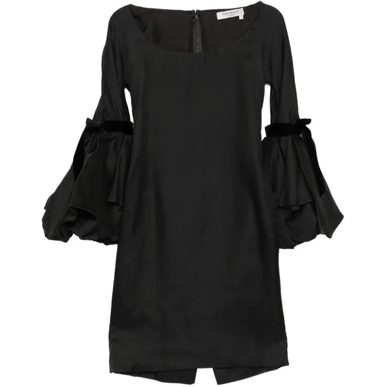 Saint Laurent 2002 silk gothic bell sleeve dress with intricate detailing and flowing silhouette on a model.