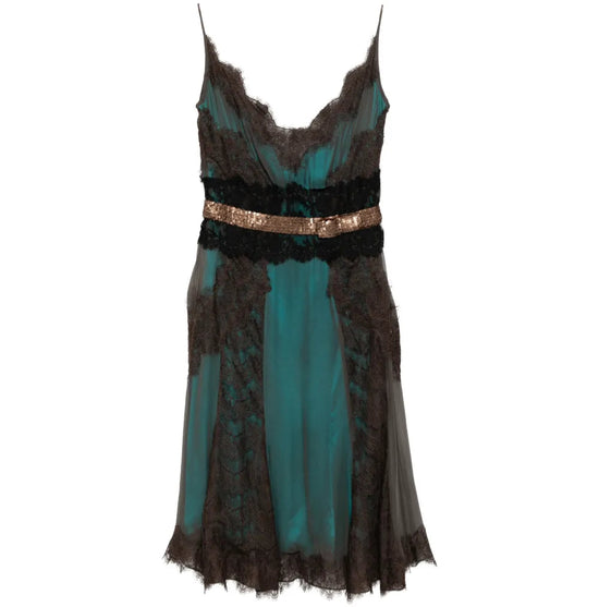 Turquoise Dolce & Gabbana cocktail dress with elegant fit and stylish design, shown on a mannequin.