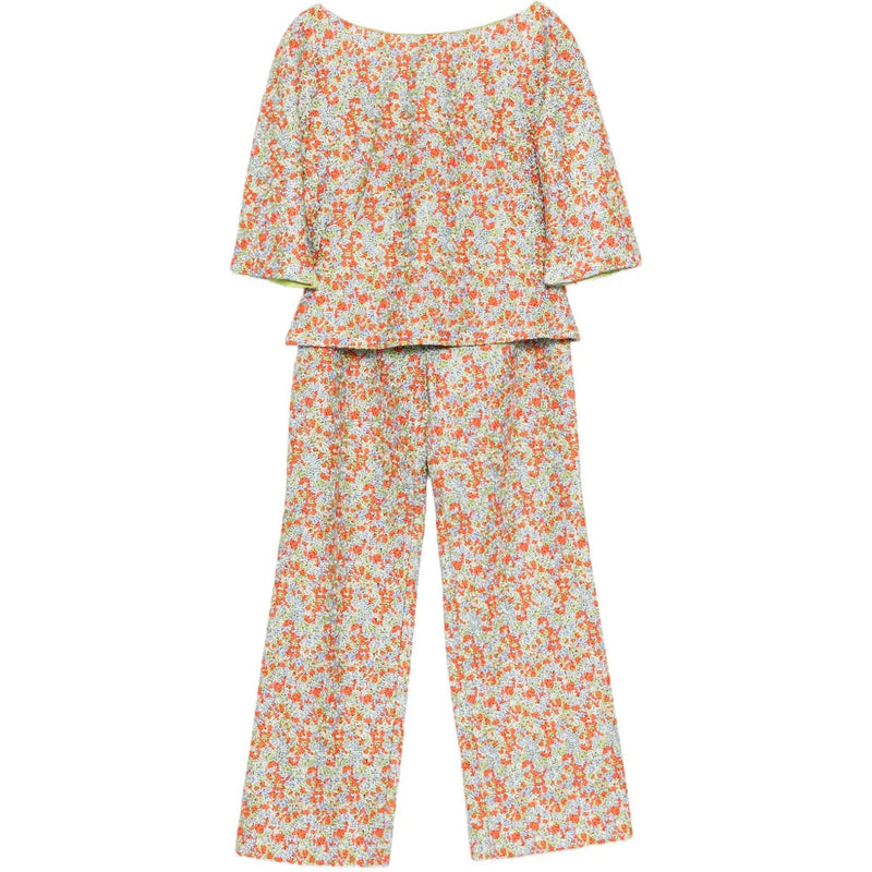 Versace ditsy floral embroidered trousers with intricate floral embroidery and tailored fit, styled with matching top.
