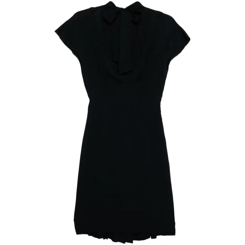 Dior short sleeve tie neck dress with a fitted waist and elegant design, shown on a model.