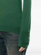 Pre-owned green wool top by CHANEL, stylish and cozy, featuring a classic design and elegant fit.
