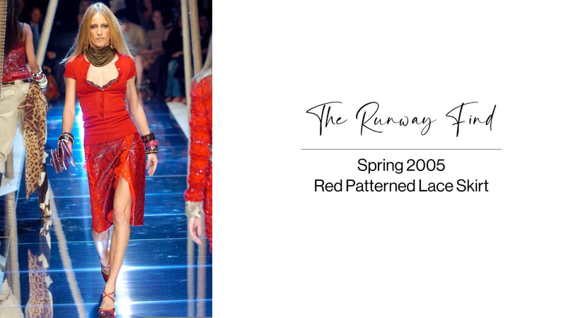 Red patterned lace skirt by Dolce & Gabbana, showcasing intricate lace details and a flowing silhouette.