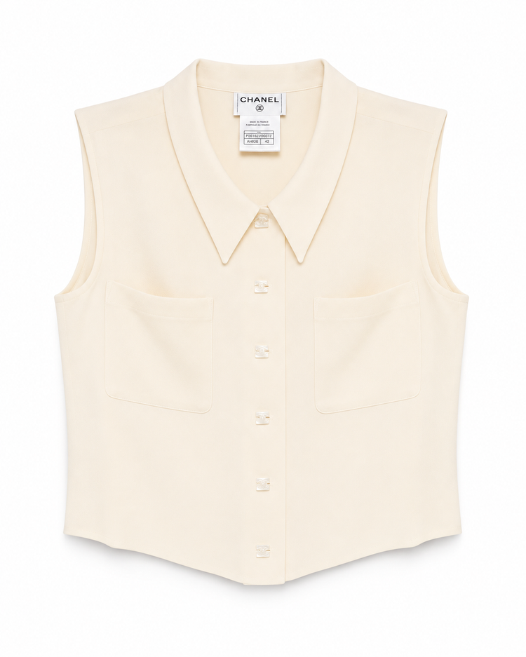 Chanel cropped collared sleeveless vest, stylish tops with button-up front and tailored fit, ideal for layered fashion looks.