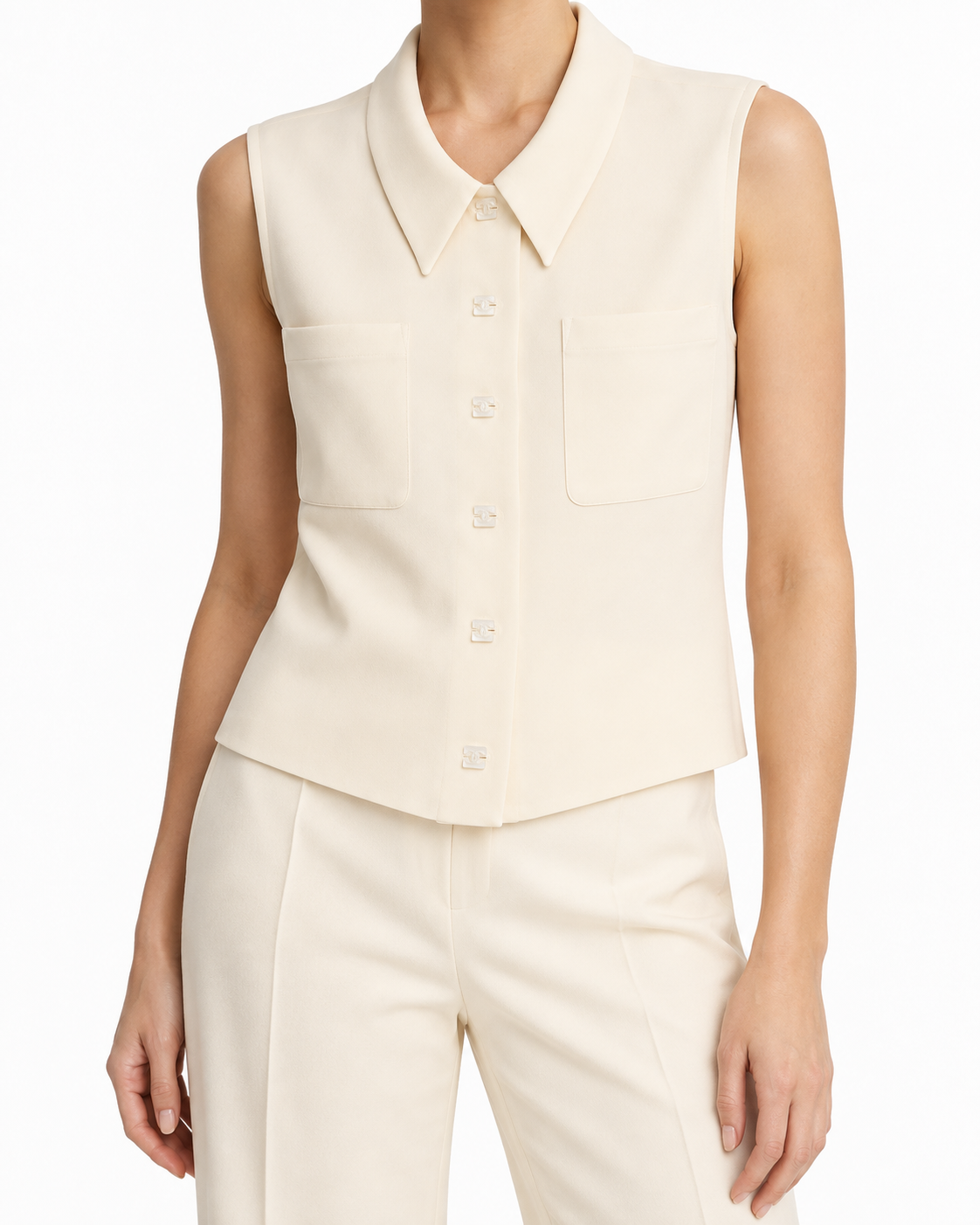 Chanel cropped collared sleeveless vest with button details, stylish top for a sophisticated layered look.
