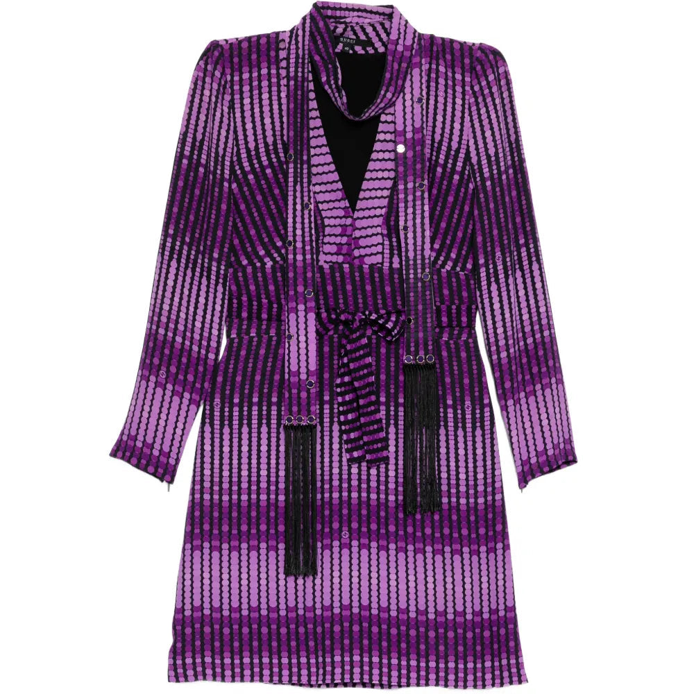 Gucci abstract print dress showcasing a colorful, artistic design with flowing fabric and elegant silhouette.