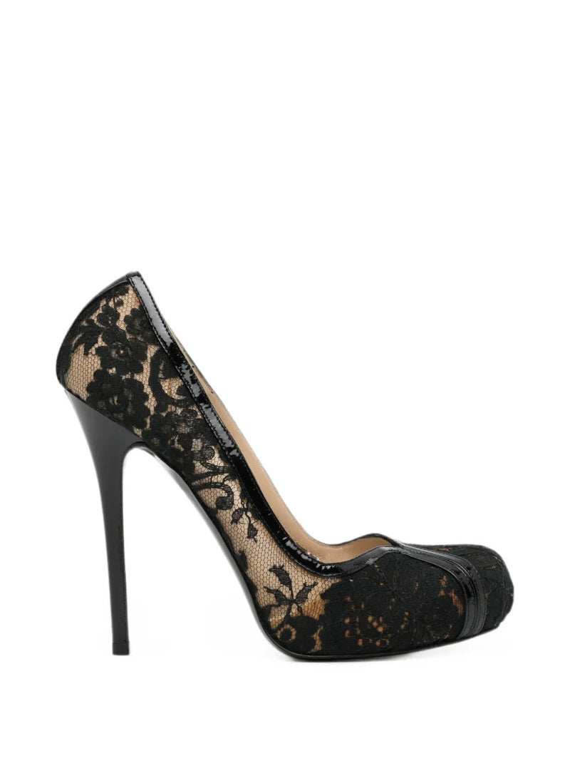 Elegant Alexander McQueen lace pumps featuring intricate lace detailing and a classic shoe silhouette.