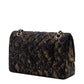 Chanel medium quilted chevre leather shoulder bag with lace detailing, gold hardware, classic double flap design in black.