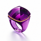 Baccarat Médicis Pop Ring in translucent magenta-purple crystal with sculptural rounded form and gold-tone accent detailing.