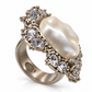 White Chanel CC ring with rhinestones, featuring a baroque pearl design, elegant cocktail ring for sophisticated style.