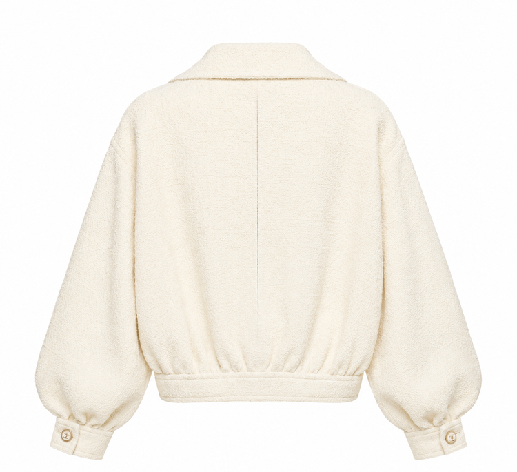 Beige Chanel cream tweed front zip blazer jacket, stylish with classic tailored fit and textured fabric.