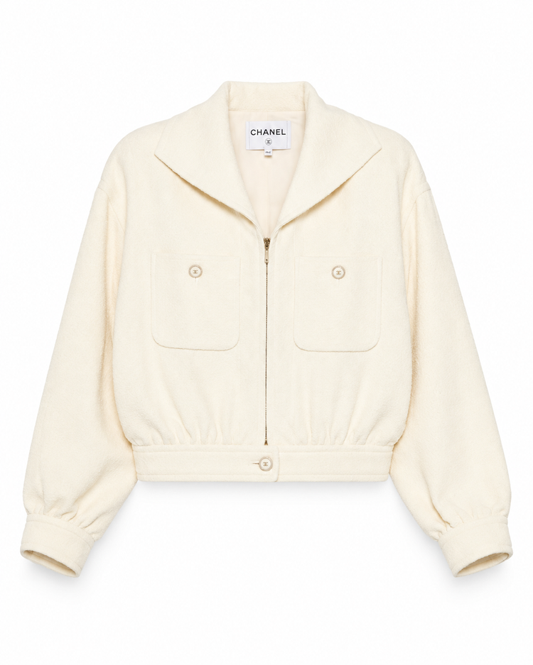 Beige Chanel cream tweed front zip blazer jacket with tailored fit and classic collar, stylish for sophisticated look.