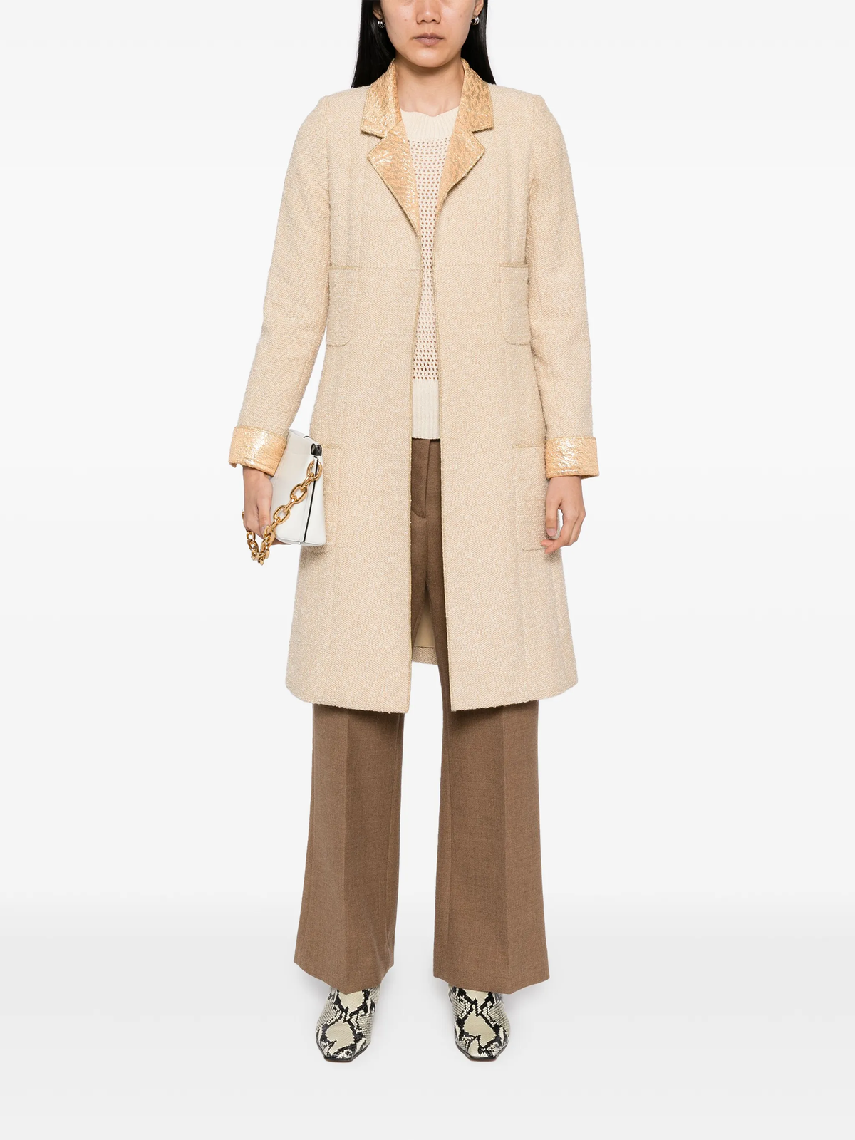 Beige wool bouclé coat with golden lamé accents, stylish Chanel coat displayed on a hanger.