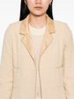 Beige wool bouclé Chanel coat with golden lamé accents, stylish and luxurious, featuring a classic tailored design.