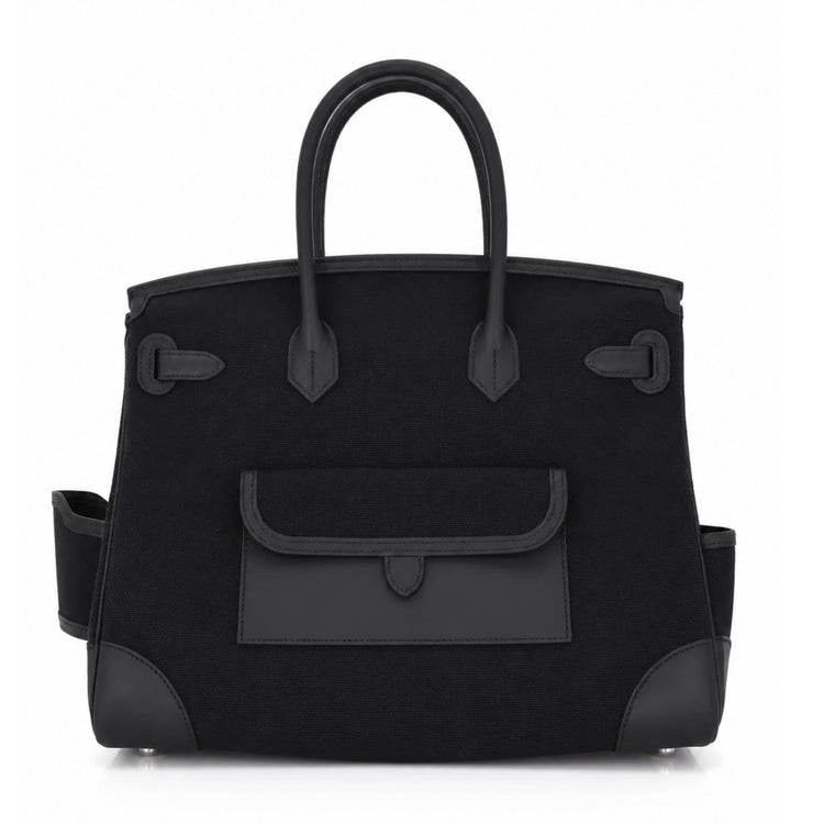 Hermès Birkin 35 Cargo Noir top handle bag in toile goéland and swift PHW leather, featuring structured design and gold hardware.