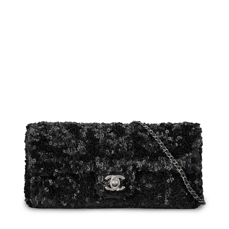 Black Chanel sequin East West Flap Bag with shoulder strap and gold-tone hardware, showcasing luxurious evening style.