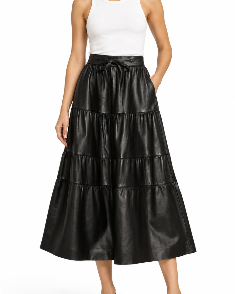 Black leather tiered skirt by Valentino featuring layered design and a sleek, modern silhouette.
