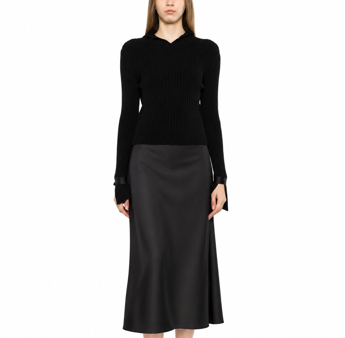 Black ribbed turtleneck sweater by Chanel, showcasing a close-up of the textured knit and classic high neckline.