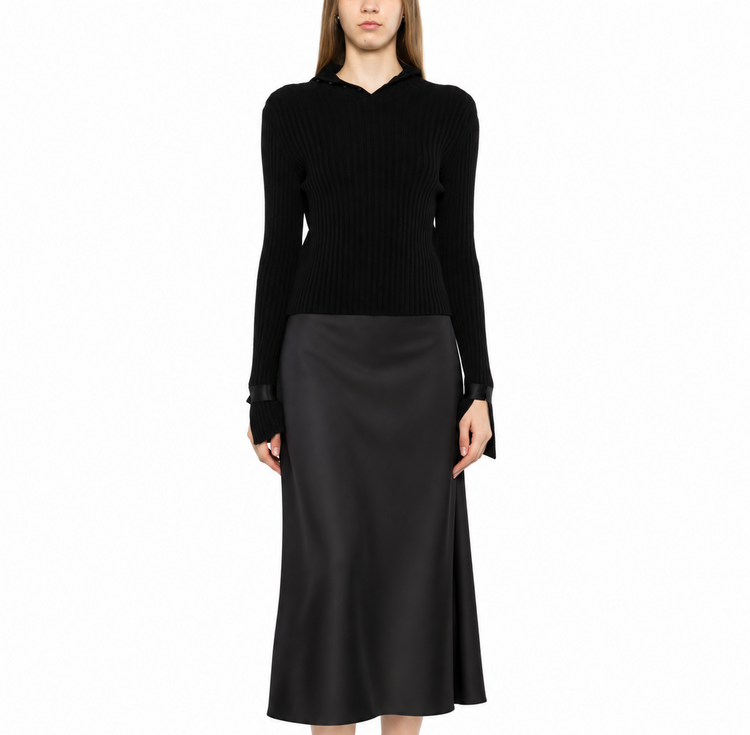 Black ribbed turtleneck sweater by Chanel, showcasing a close-up of the textured knit and classic high neckline.