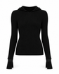 Black ribbed turtleneck sweater by Chanel, close-up of the fitted knit top with high neckline and textured fabric.