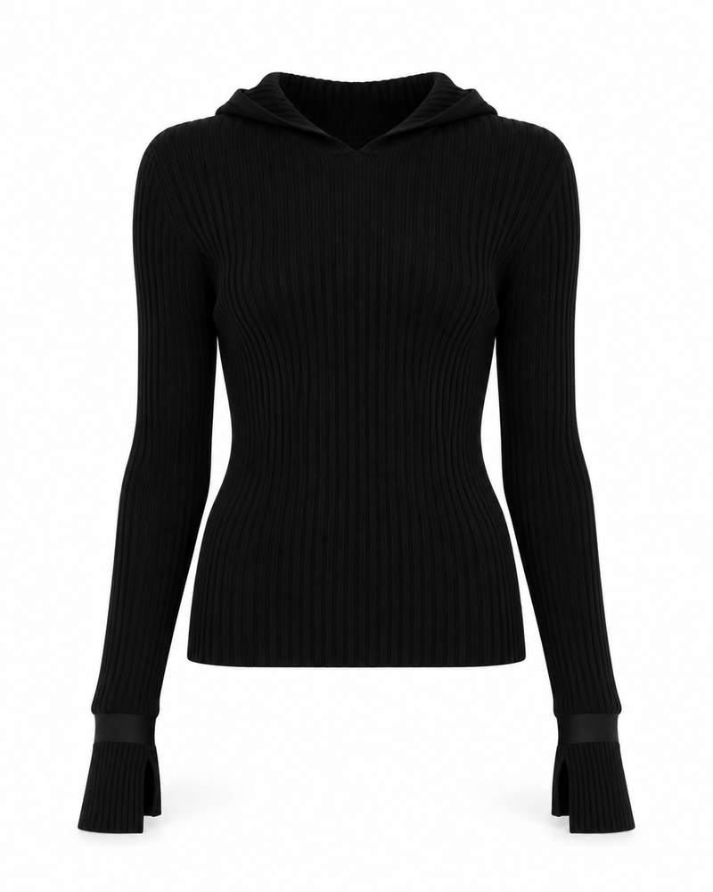 Black ribbed turtleneck sweater by Chanel, close-up of the fitted knit top with high neckline and textured fabric.
