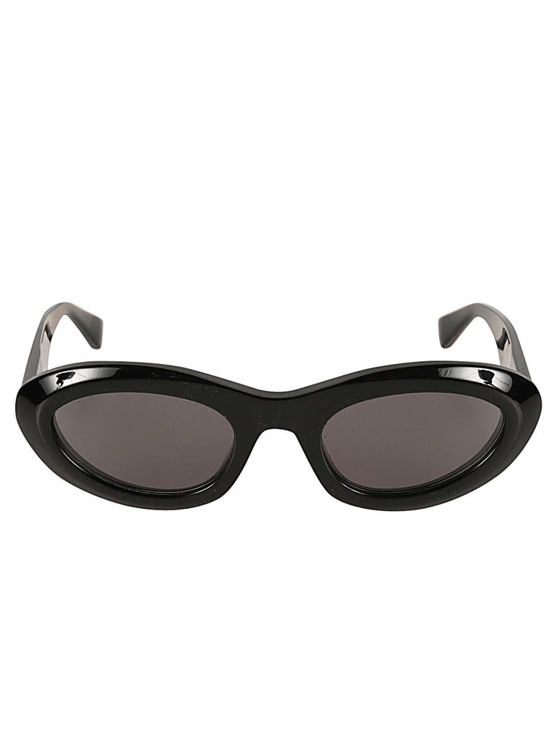 Bottega Veneta Almond Sunglasses in glossy black with narrow oval frames, dark tinted lenses and sculpted temples.