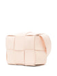 Bottega Veneta Candy Cassette Crossbody Bag in blush pink leather with oversized intrecciato weaving, structured rectangular silhouette and adjustable shoulder strap.