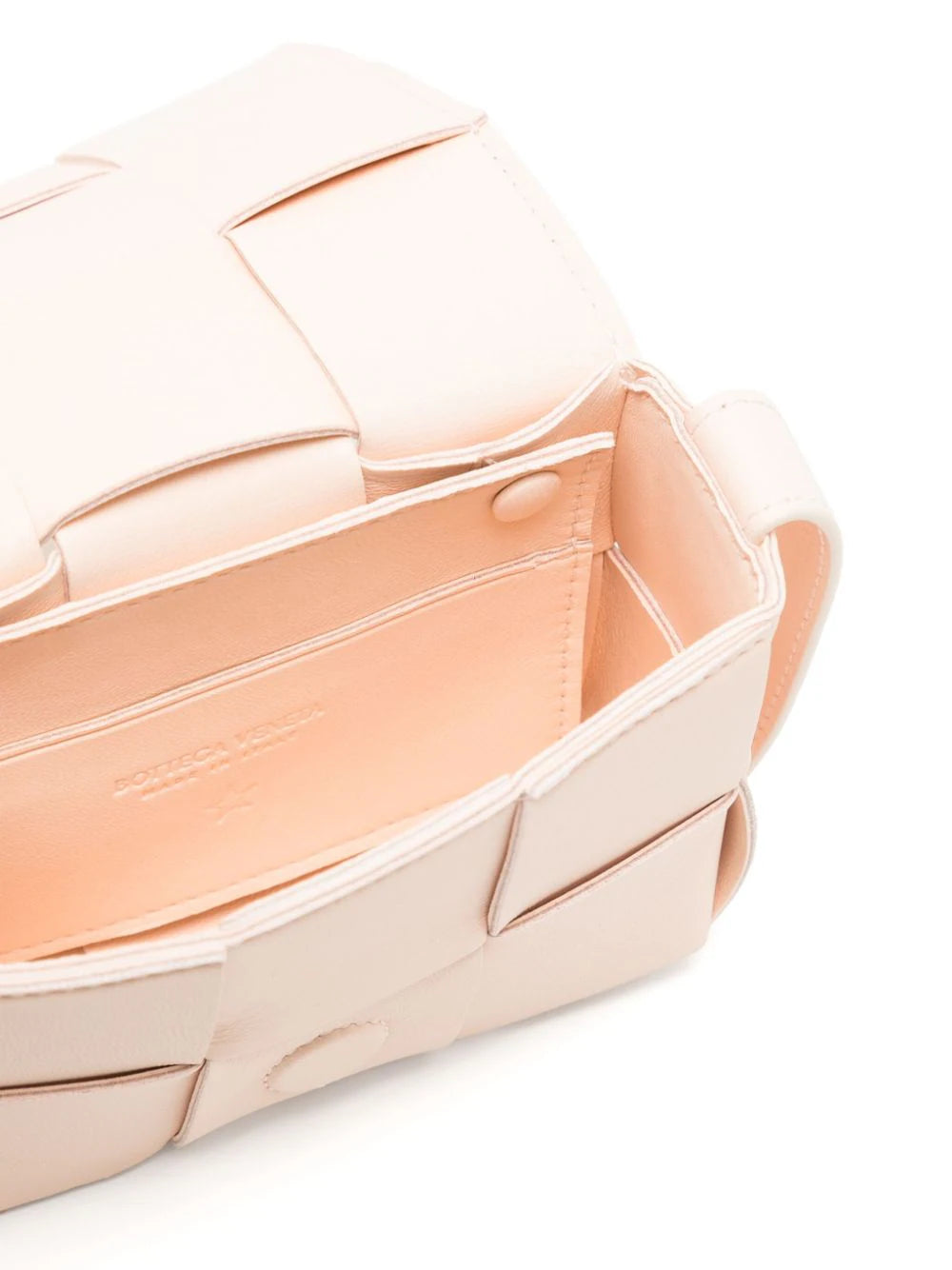 Bottega Veneta Candy Cassette crossbody bag with colorful striped shoulder strap and sleek rectangular design.