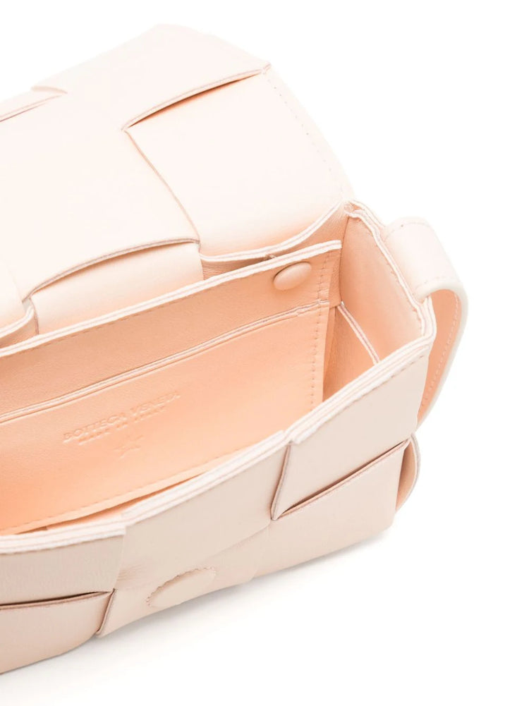 Bottega Veneta Candy Cassette crossbody bag with colorful striped shoulder strap and sleek rectangular design.