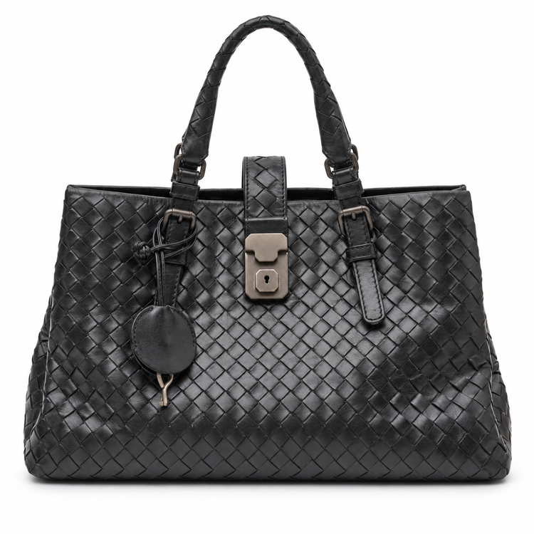 Bottega Veneta Intrecciato Roma Tote Bag in black woven leather with dual top handles, central metal lock fastening and hanging key clochette.