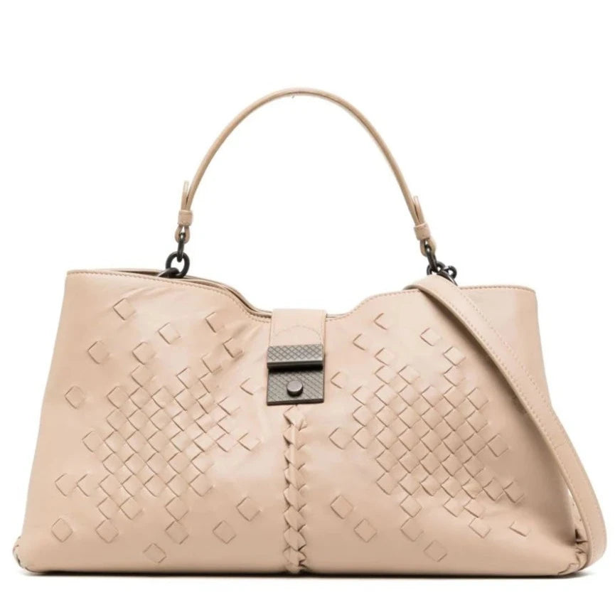 Bottega Veneta Intrecciato Roma Tote in beige leather with woven detailing, top handle, detachable shoulder strap and metal clasp fastening.