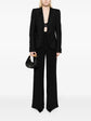 Bottega Veneta black single-breasted blazer with satin-trimmed notched lapels, single-button fastening, long sleeves and front flap pockets.