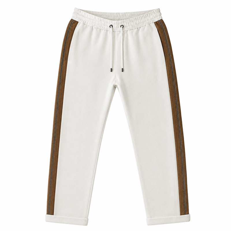White Brunello Cucinelli jogger trousers with a relaxed fit and elastic waistband, displayed flat on a neutral background.