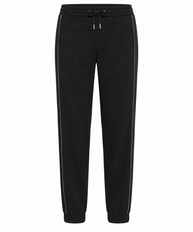 Brunello Cucinelli black jogger pants made of soft fabric, featuring a relaxed fit with elastic waistband and cuffed ankles.