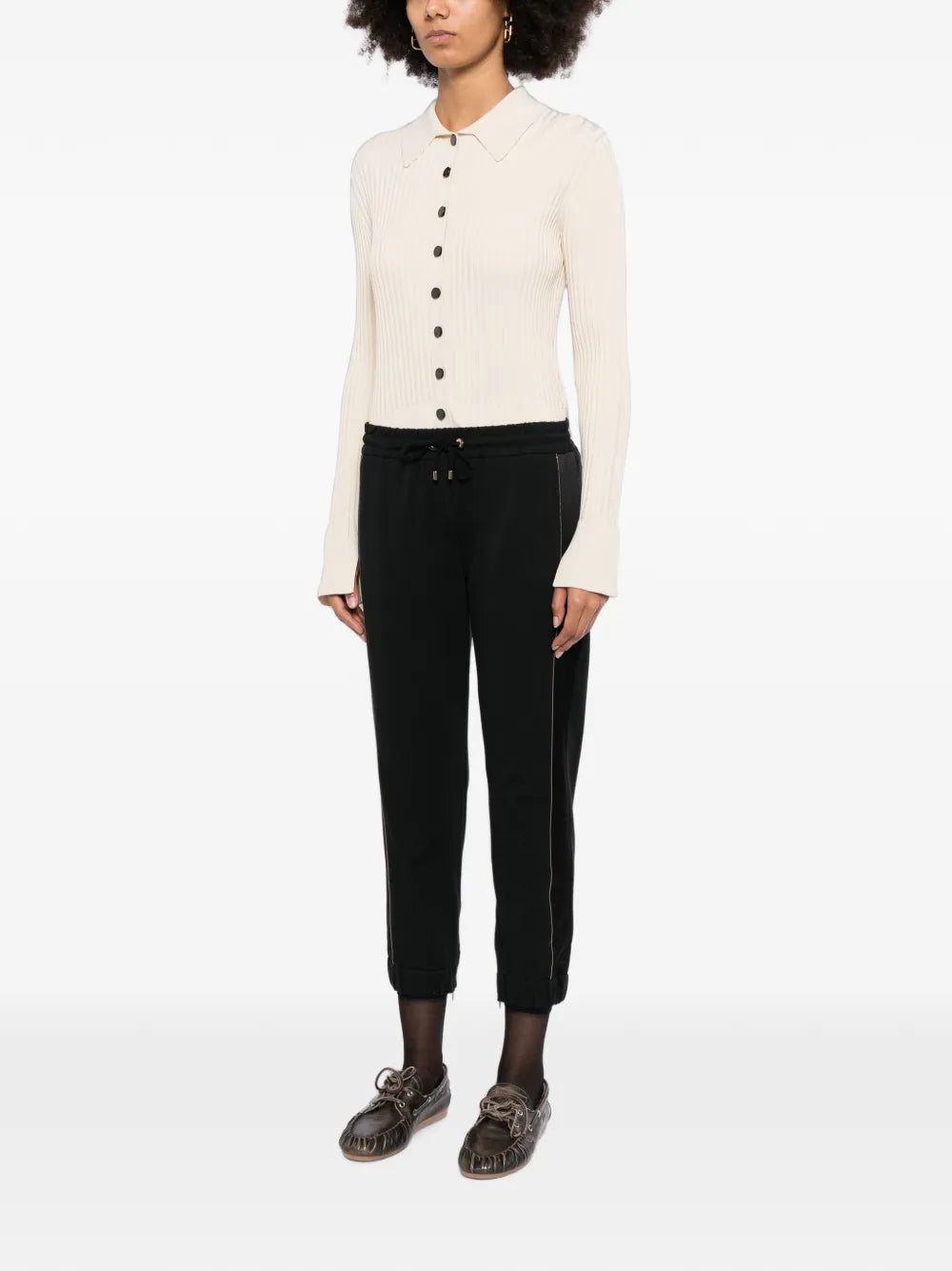 Brunello Cucinelli black jogger trousers shown flat with elastic waistband and tapered cuffs, made from soft fabric for casual comfort.
