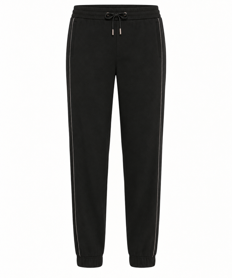 Brunello Cucinelli black jogger pants made of soft fabric, featuring a relaxed fit with elastic waistband and cuffed ankles.