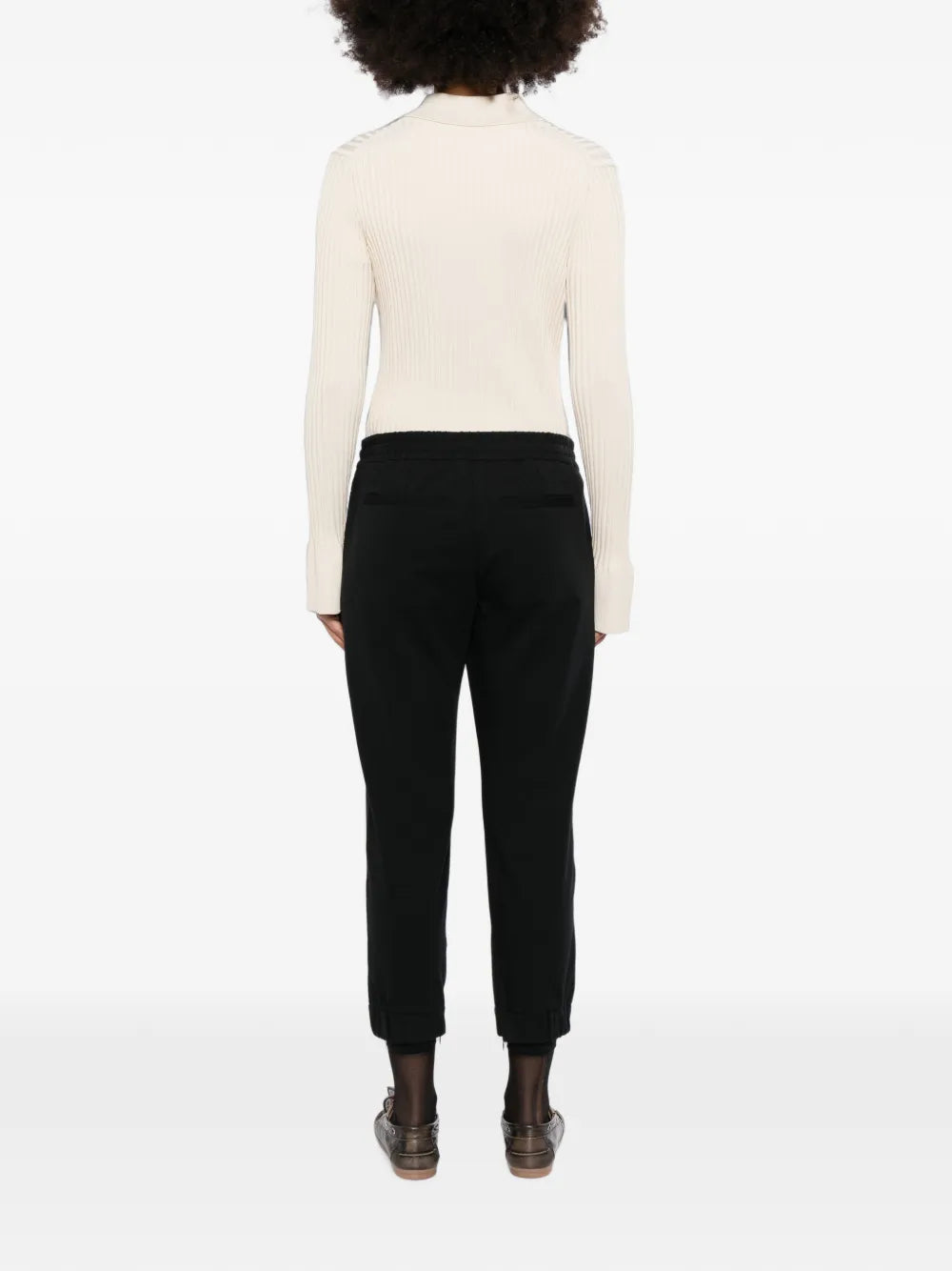 Back view of Brunello Cucinelli black jogger trousers, showcasing the relaxed fit and stylish waistband.