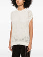Brunello Cucinelli sleeveless knitted vest in soft beige, close-up of the textured knit fabric and sleeveless design.