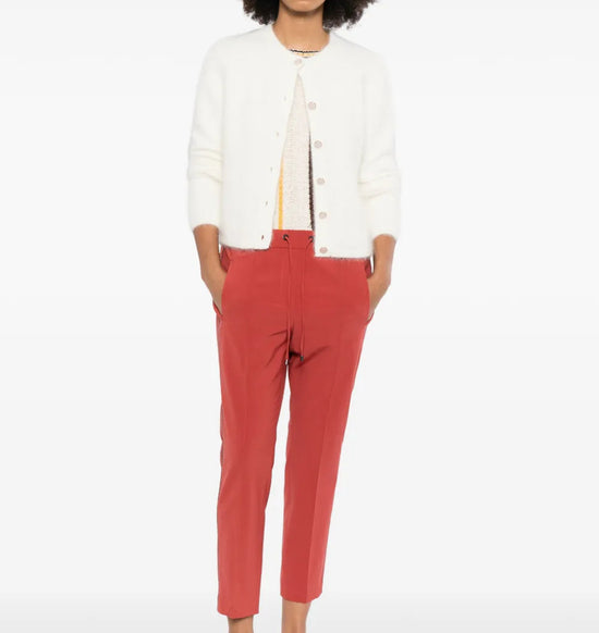 Red Brunello Cucinelli drawstring trousers with a relaxed fit and stylish waistband, shown on a model.