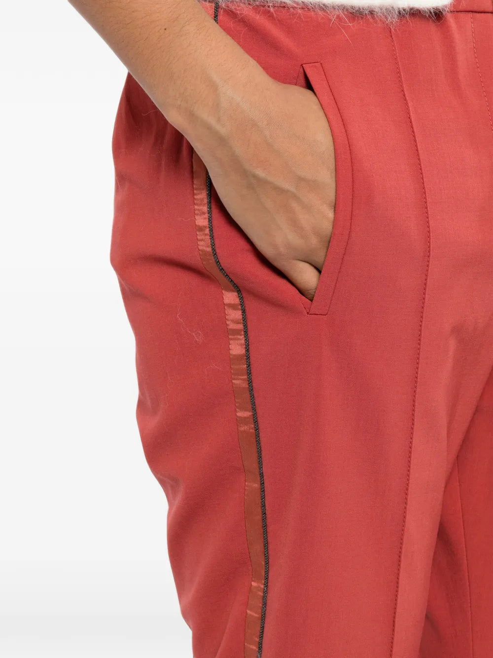 Red Brunello Cucinelli drawstring trousers with a relaxed fit, featuring adjustable waist ties and tailored fabric design.