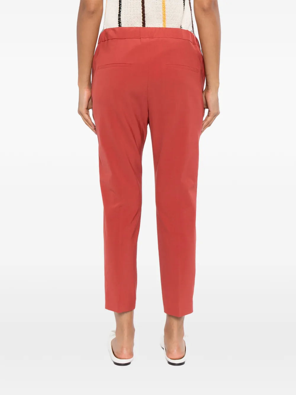 Back view of Brunello Cucinelli red drawstring trousers showing waistband and relaxed fit.