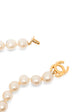 Vintage Chanel single-strand faux pearl choker necklace featuring a gold-tone interlocking CC turn-lock clasp centerpiece.