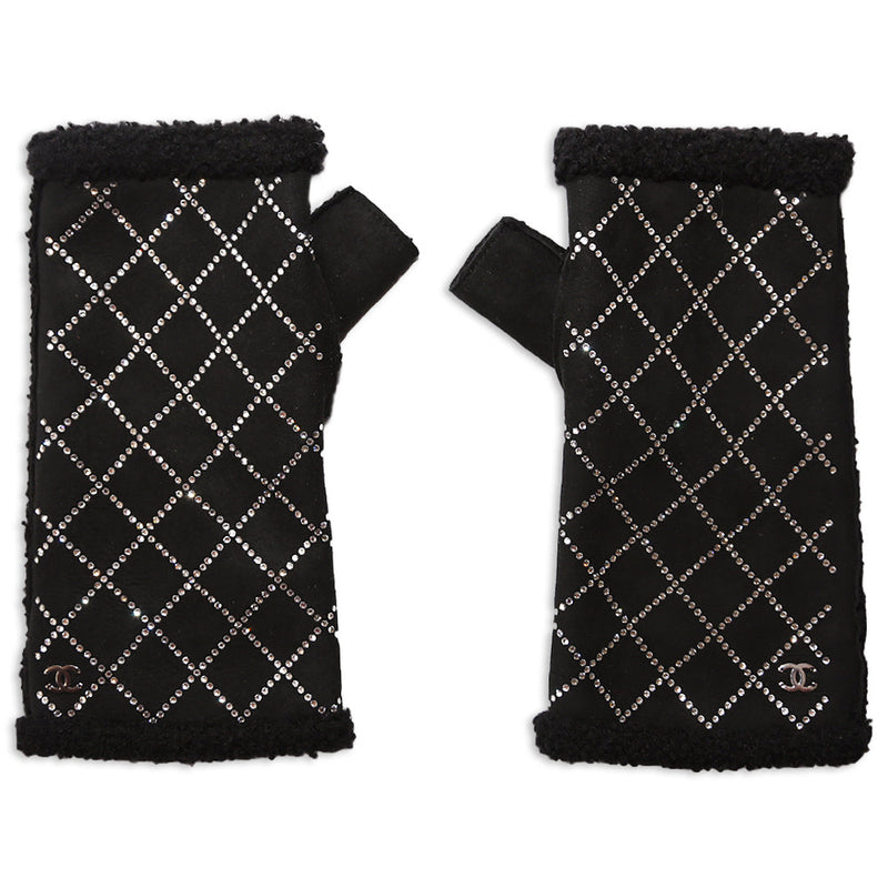 Black Chanel handwarmers with crystal studs, stylish gloves designed for warmth and elegance in winter accessories.