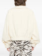 Pre-owned CHANEL tweed jacket featuring classic woven fabric and elegant design, displayed on a hanger.