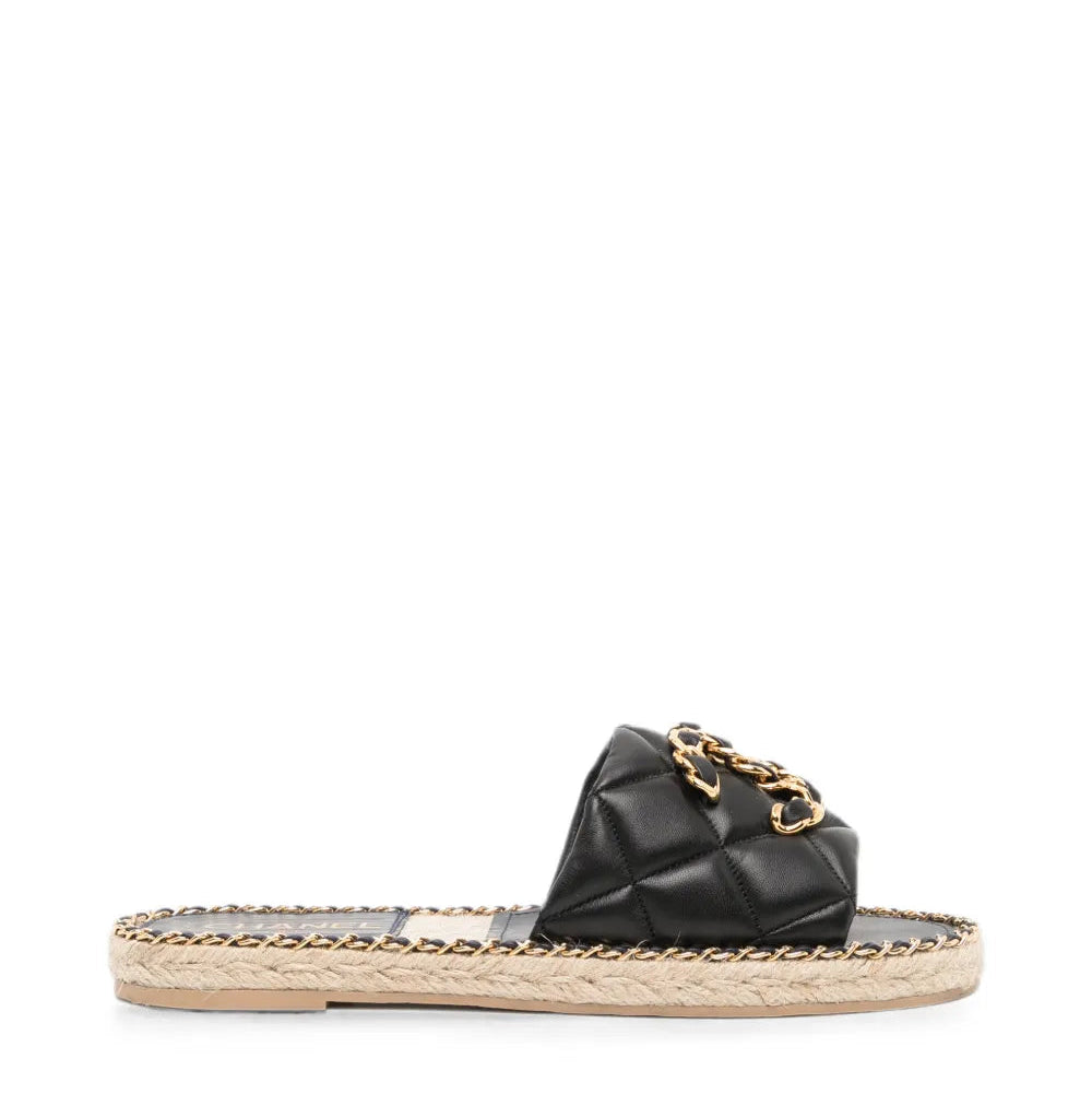 Pre-owned CHANEL quilted leather espadrilles with jute soles, stylish slip-on shoes for casual and chic summer wear.