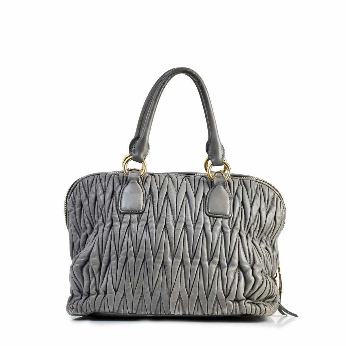 Miu Miu Matelassé tote bag showing textured quilted design and sturdy handles from the back view.