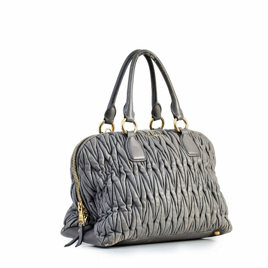 Miu Miu Matelassé tote bag shown from the side, featuring quilted design and elegant structure.