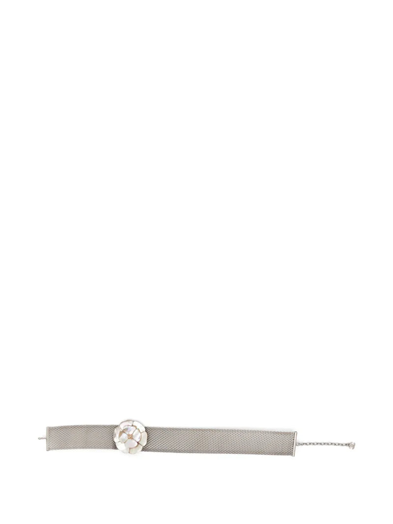 Chanel Camellia choker necklace featuring a delicate floral design with gold-tone accents and intricate detailing.