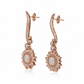 Carrera y Carrera Sol y Sombra diamond sun earrings with sparkling gold and diamond accents, featuring a sunburst design.