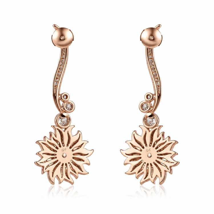 Carrera y Carrera Sol y Sombra diamond sun earrings with sparkling gold and diamond accents, featuring a sunburst design.
