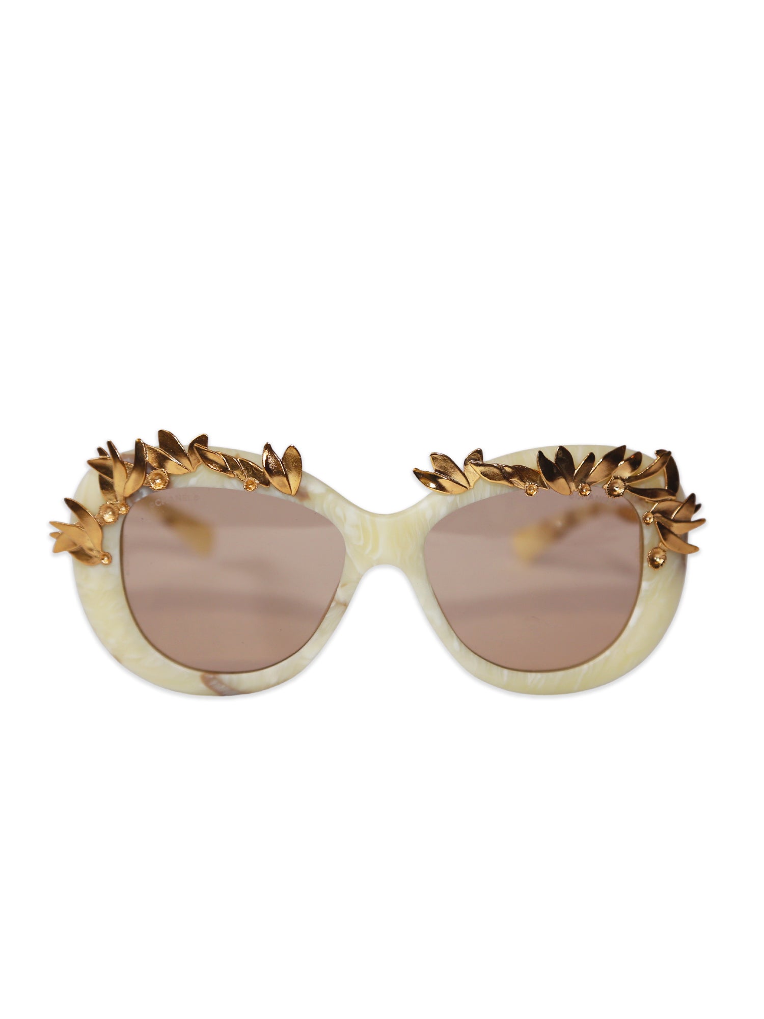 Chanel Sunglasses with gold decorative elements on a white background